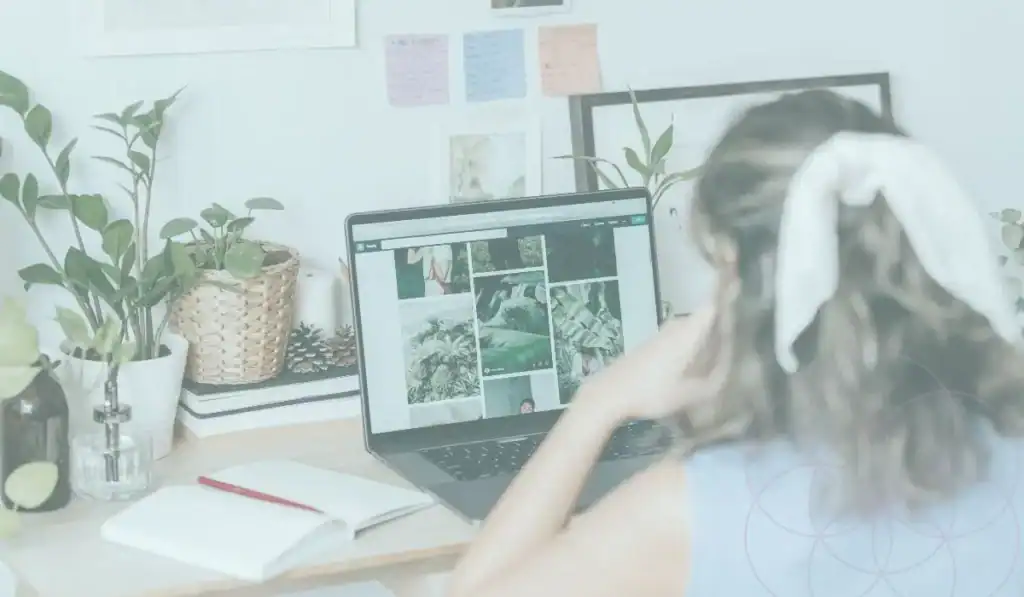 Woman Sitting at computer looking at photo images
